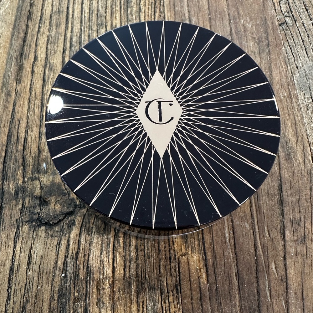 Charlotte Tilbury Magic Powder - Deep Brown Lid with Pale Pink Text